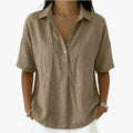 Women's oversized short sleeve blouse with pointed collar and partial button placket