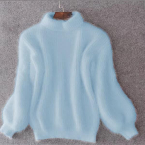 Women's loose turtleneck knit sweater with long sleeves and ribbed trims